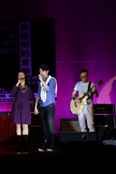 Singing performance by Ms Judy Tong (left), a visually impaired person, and the DSU